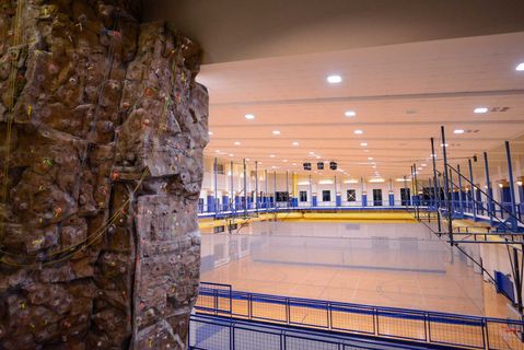 view of the climbing wall and running track