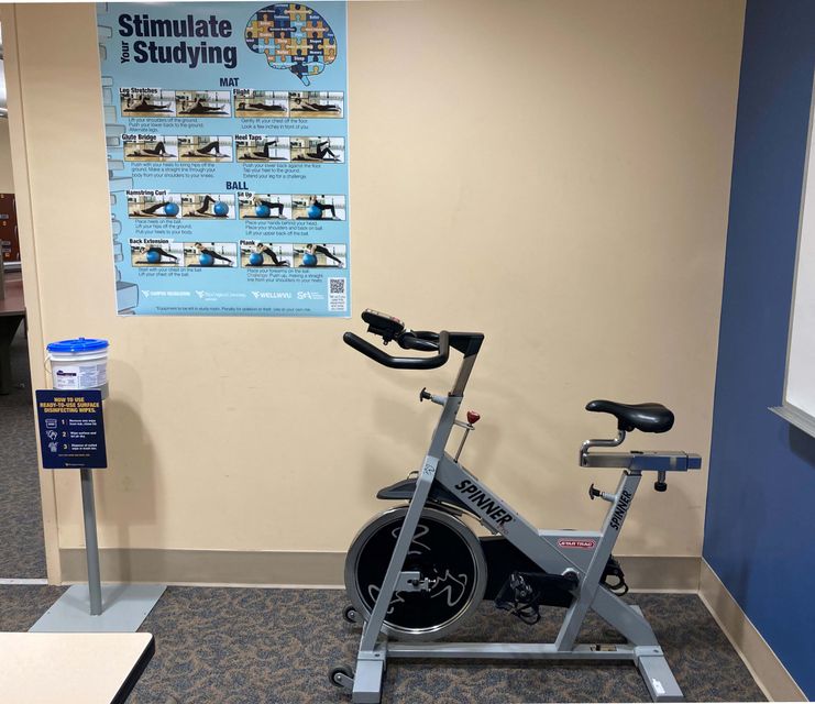 Active Study Room picture with bike and fitness poster and wipes
