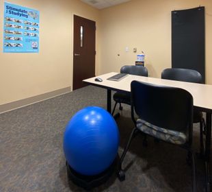 Active Study Room picture with mat, ball/chair and fitness poster and wipes