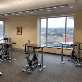 Downtown library 6th floor windows with 5 bikes 4 adjustable desks
