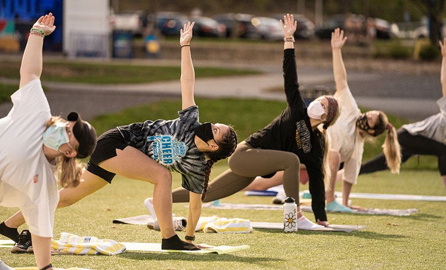 An outdoor pop up fitness yoga class